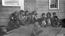 Eskimo children and puppies at the Moravian Mission Station, between c1900 and c1930. Creator: Unknown