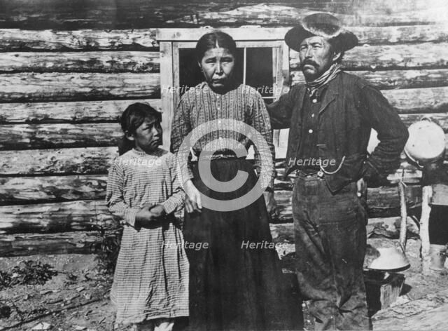 Eskimo father, mother and child, between c1900 and c1930. Creator: Unknown.