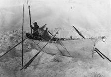 Eskimo in boat made with skins called an umiak, between c1900 and c1930. Creator: Unknown