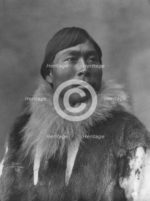 Eskimo posing , c1903, printed (1927?). Creator: Lomen Brothers.