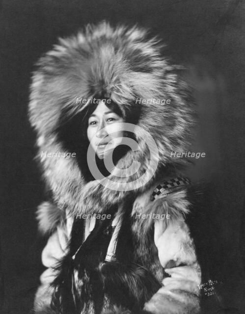 Eskimo woman posing, 1915(?). Creator: Lomen Brothers.