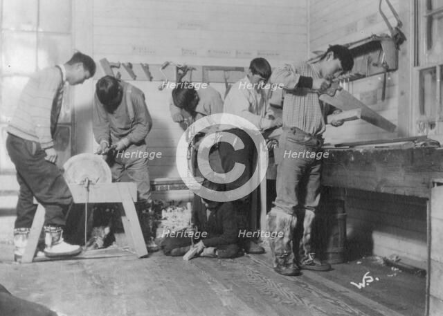 Eskimos doing carpenter work, between c1900 and c1930. Creator: Unknown.