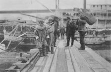 Eskimos on a dock, between c1900 and 1916. Creator: Unknown