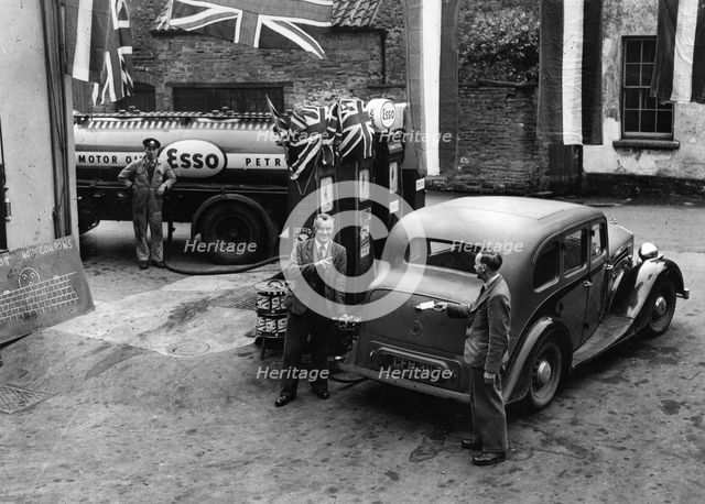 Esso garage at the end of petrol rationing 1950. Creator: Unknown.