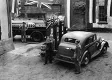 Esso garage at the end of petrol rationing 1950. Creator: Unknown