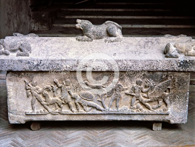 Etruscan stone sarcophagus with reliefs of Eastern influence.