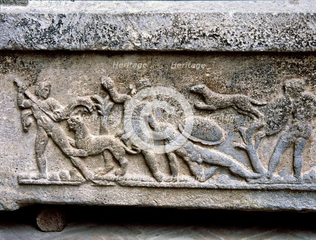 Etruscan stone sarcophagus with reliefs of Eastern influence, with scenes of hunting and battle.