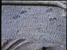 Etruscan writing in a stone sarcophagus with reliefs of Eastern influence