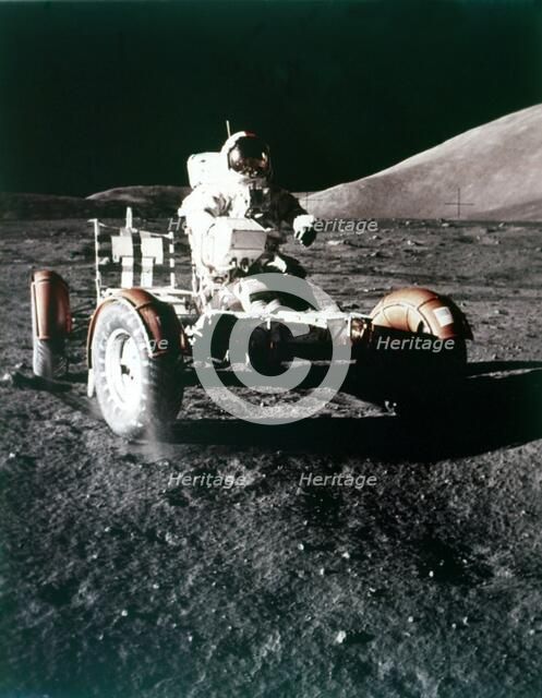 Eugene Cernan using the Rover on the lunar surface, Apollo 17 mission, December 1972. Creator: NASA.