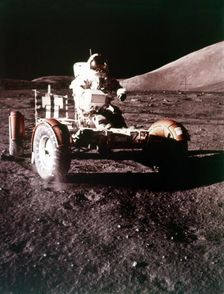 Eugene Cernan using the Rover on the lunar surface, Apollo 17 mission, December 1972. Creator: NASA