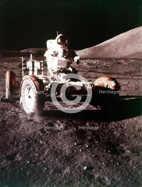 Eugene Cernan using the Rover on the lunar surface, Apollo 17 mission, December 1972. Creator: NASA.