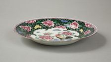 European copy of famille noire plate with cockerel looking at a butterfly, 20th century