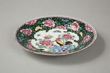 European copy of famille noire plate with cockerel looking at a butterfly, 20th century