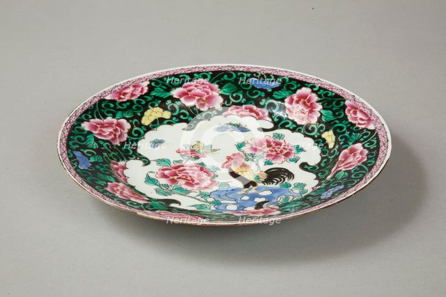 European copy of famille noire plate with cockerel looking at a butterfly, 20th century. Artist: Unknown.