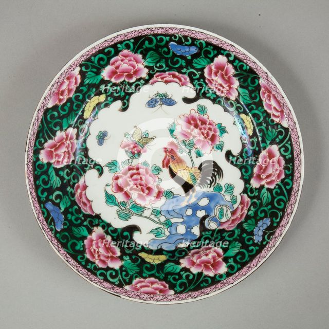 European copy of famille noire plate with cockerel looking at a butterfly, 20th century. Artist: Unknown.