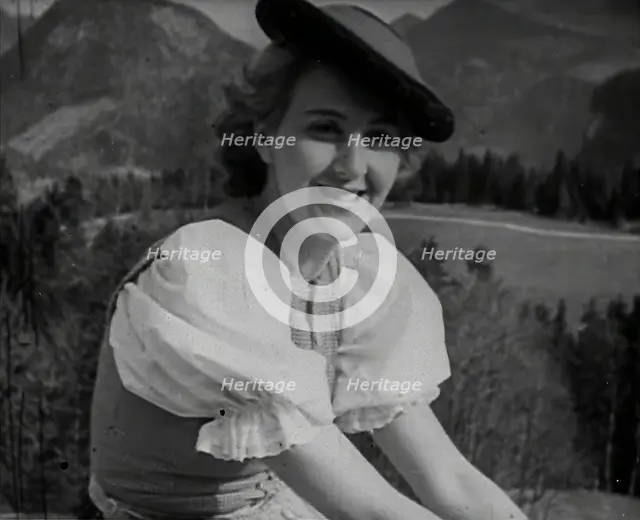 Eva Braun Sitting on a Wall, 1942. Creator: British Pathe Ltd.