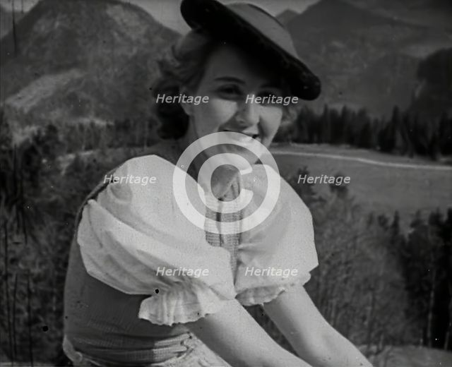 Eva Braun Sitting on a Wall, 1942. Creator: British Pathe Ltd.