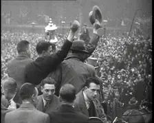 Everton Players Waving to Crowds With the FA Cup, 1930s. Creator: British Pathe Ltd