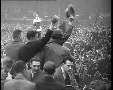 Everton Players Waving to Crowds With the FA Cup, 1930s. Creator: British Pathe Ltd
