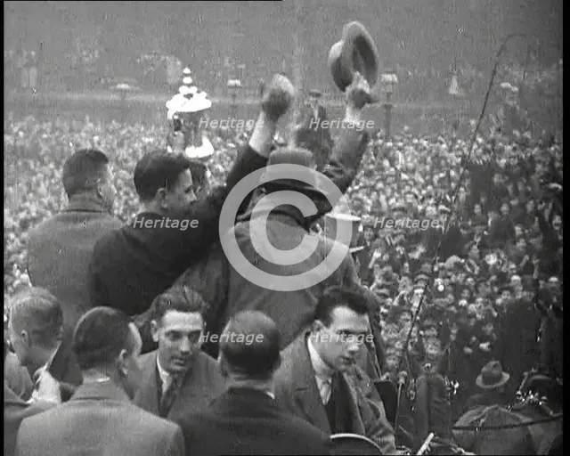 Everton Players Waving to Crowds With the FA Cup, 1930s. Creator: British Pathe Ltd.