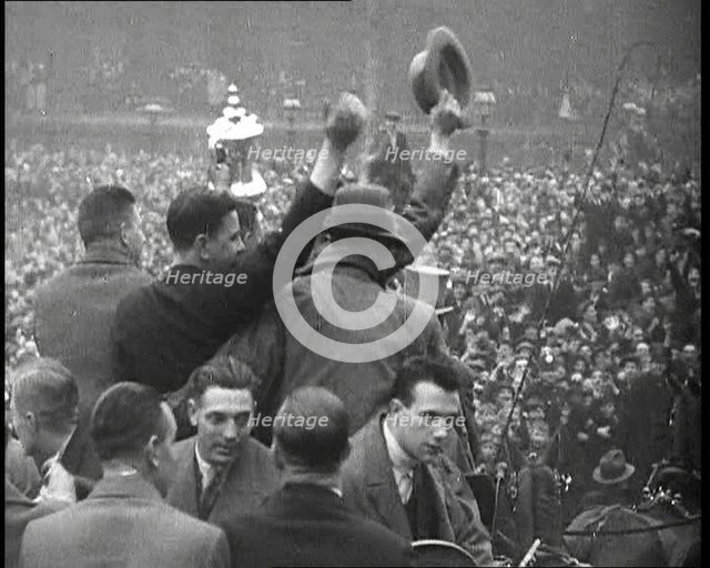 Everton Players Waving to Crowds With the FA Cup, 1930s. Creator: British Pathe Ltd.