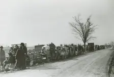 Evicted African American sharecroppers standing with their belongings along Highway 60..., Jan 1939. Creators: Farm Security Administration, Arthur Rothstein