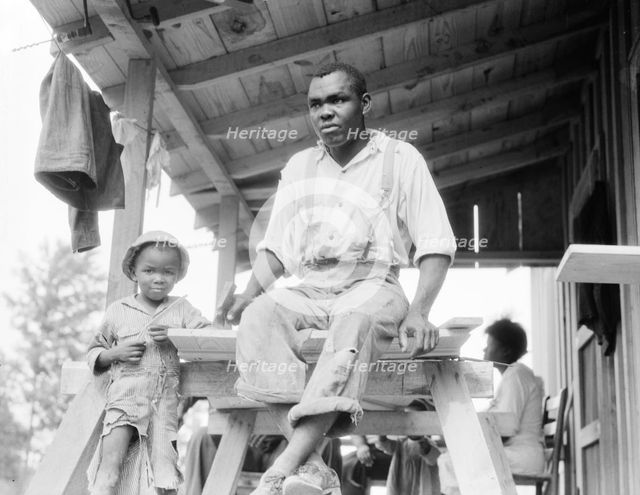 Evicted Arkansas sharecropper, now building his new home at Hill House, Mississippi, 1936. Creator: Dorothea Lange.