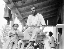 Evicted Arkansas sharecropper, now building his new home at Hill House, Mississippi, 1936. Creator: Dorothea Lange