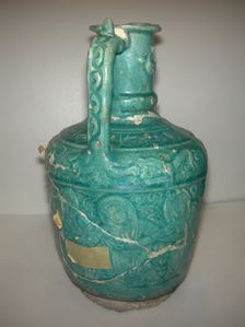 Ewer with Molded Inscriptions, Animals and Dancers, Iran, last quarter 11th or 12th century. Creator: Abu Ahmad Qassai