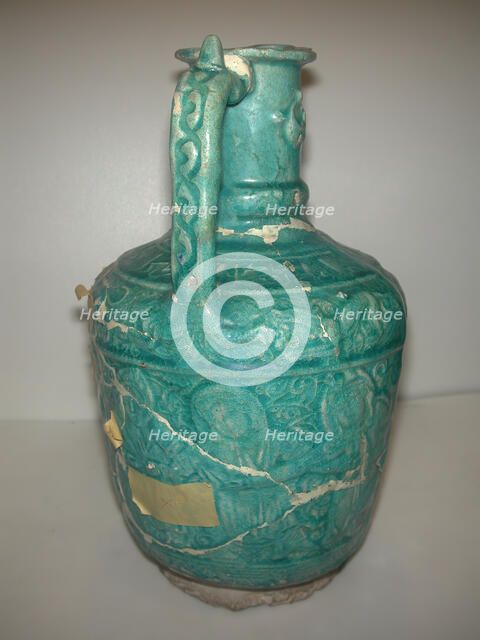 Ewer with Molded Inscriptions, Animals and Dancers, Iran, last quarter 11th or 12th century. Creator: Abu Ahmad Qassai.