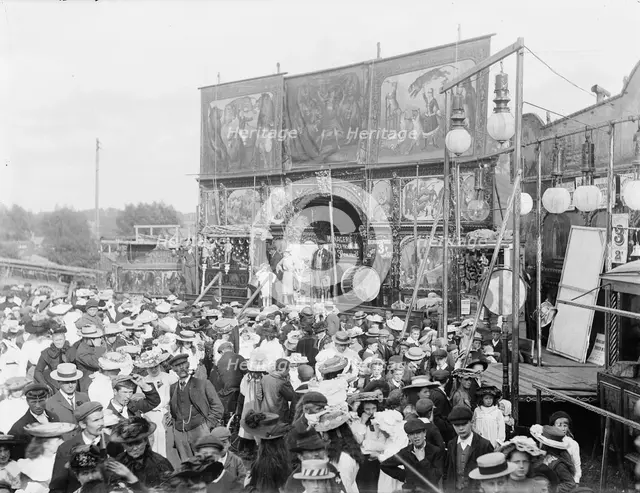 Exterior general view of Purchases Menagerie and crowd at Witney Fair, Oxfordshire, 1860-1922. Creator: Henry Taunt.