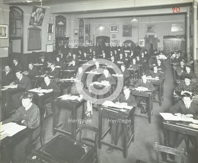 Examination class for male and female students, Queen's Road Evening Institute, London, 1908. Artist: Unknown.