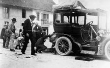 Examination of luggage on automobile, by Customs(?), France, 1905. Creator: Frances Benjamin Johnston