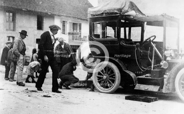 Examination of luggage on automobile, by Customs(?), France, 1905. Creator: Frances Benjamin Johnston.
