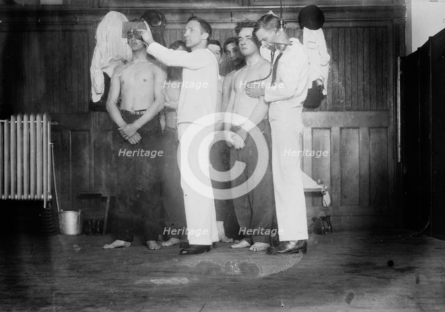 Examining new Navy Recruits, between c1910 and c1915. Creator: Bain News Service.