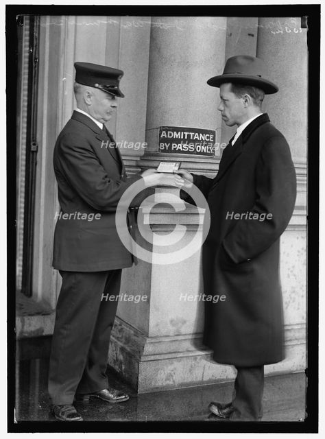 Examining pass at State Department Building, between 1913 and 1918. Creator: Harris & Ewing.