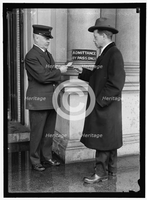 Examining pass at State Department Building, between 1913 and 1918. Creator: Harris & Ewing.