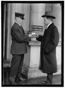 Examining pass at State Department Building, between 1913 and 1918. Creator: Harris & Ewing