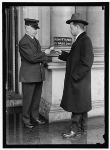 Examining pass at State Department Building, between 1913 and 1918. Creator: Harris & Ewing
