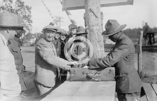 Examining pkges, Camp Upton, Sept 1917. Creator: Bain News Service.