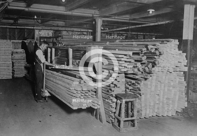 Examining spruce for planes, between c1915 and c1920. Creator: Bain News Service.