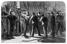 Examining the Atlantic Telegraph Cable, after raising it, on board the Great Eastern, 1865. Creator: Unknown