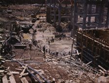 Excavating within the log cofferdam during an early stage of construction, Douglas Dam, Tenn., 1942. Creator: Alfred T Palmer