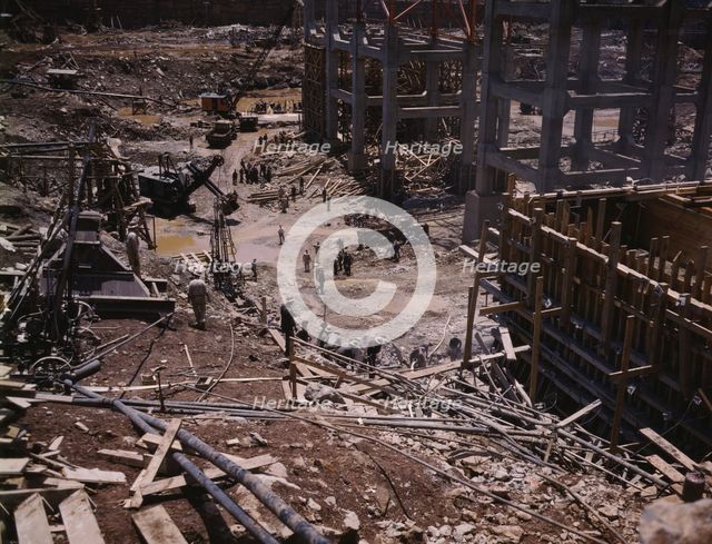 Excavating within the log cofferdam during an early stage of construction, Douglas Dam, Tenn., 1942. Creator: Alfred T Palmer.