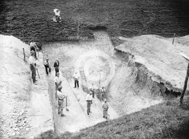 Excavation at Avebury, Wiltshire, 1909. Artist: Harold St George Gray