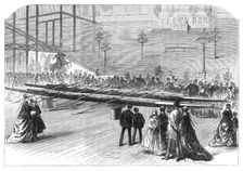 Exhibition of the Oxford and Cambridge boats at the Crystal Palace, 1869. Creator: Unknown