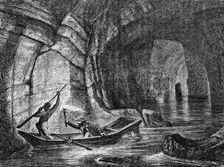 Exploring a subterranean river in the Mammoth Cave, Kentucky, USA, c1870