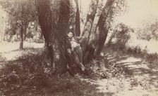 F.A. Williams resting against a tree, 1892. Creator: Unknown
