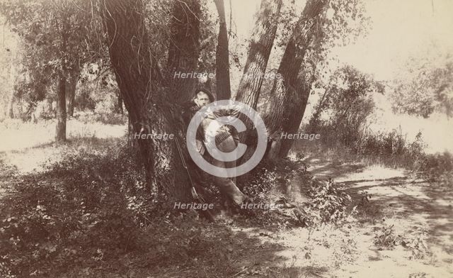 F.A. Williams resting against a tree, 1892. Creator: Unknown.