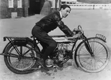 F Ball riding a 1913 Douglas motorbike, (c1913?)